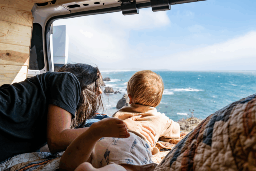 Family enjoying a road trip in their camper van with mountain views – van life in Lake Tahoe