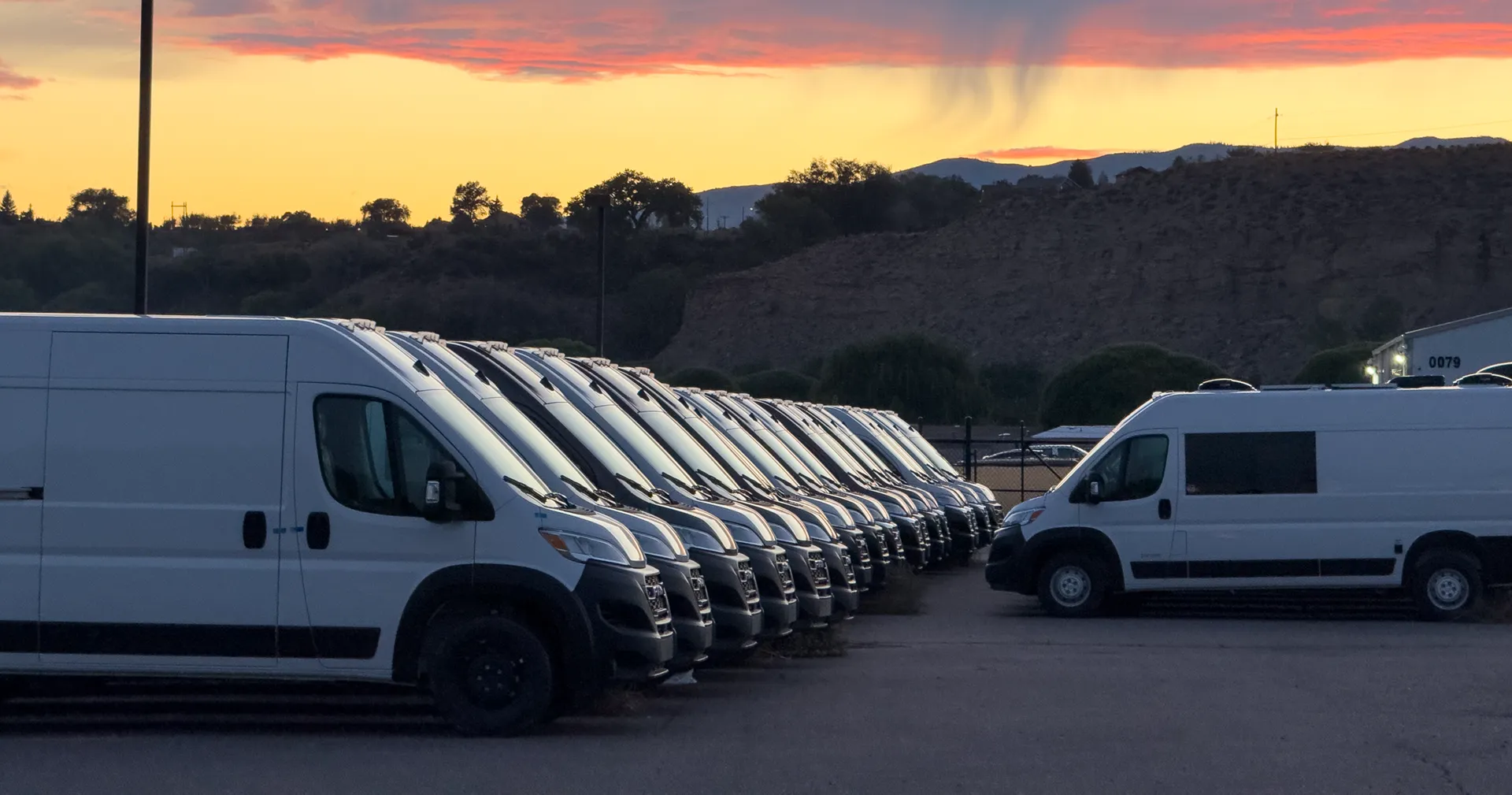 DM Vans team members building camper vans by hand on the shop floor in Rifle, Colorado